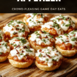 A vibrant spread of Super Bowl appetizers on a rustic wooden board: crispy buffalo chicken wings with reddish-orange glaze, creamy spinach-artichoke dip in a burnt orange ceramic dish with visible bubbly cheese, savory meatballs in rich tomato sauce glistening under soft light, and colorful jalapeño-lime deviled eggs with bright green and yellow contrasts. Garnished with fresh parsley, red onion slices, and lime wedges. Natural light, shallow depth of field, uncluttered background.